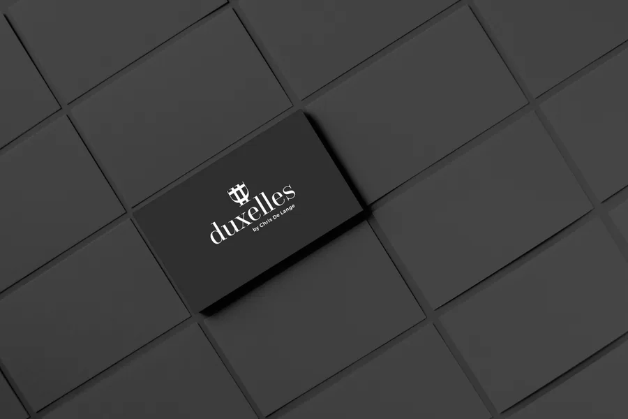 Duxelles black card brand application with premium logo finish